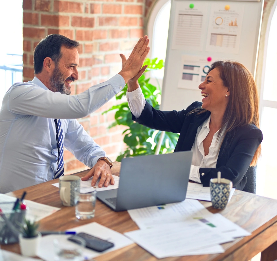 A women and a man high-five each other